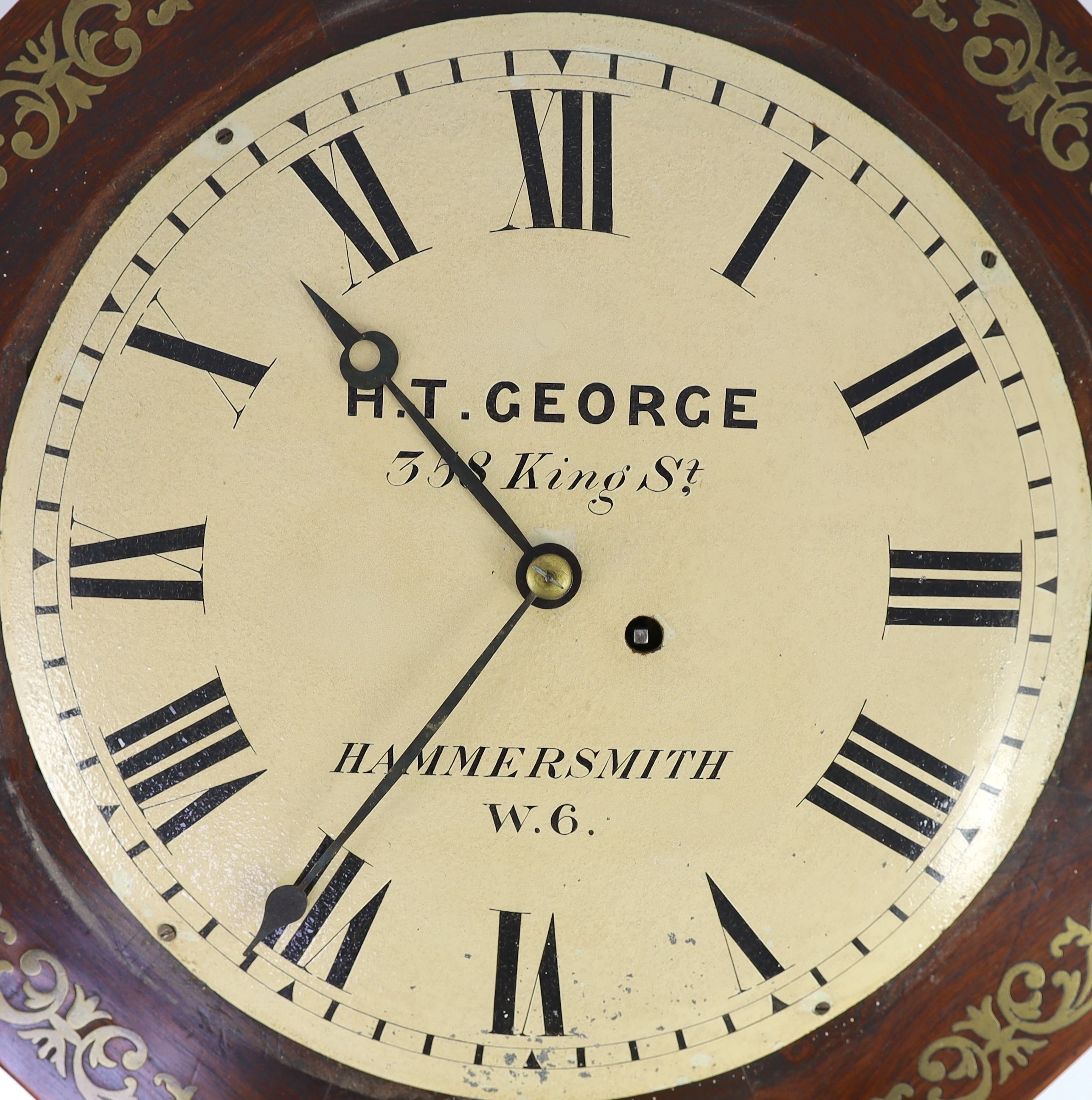 H.T. George, 358 King St, Hammersmith. A William IV octagonal rosewood dial clock 43cm.